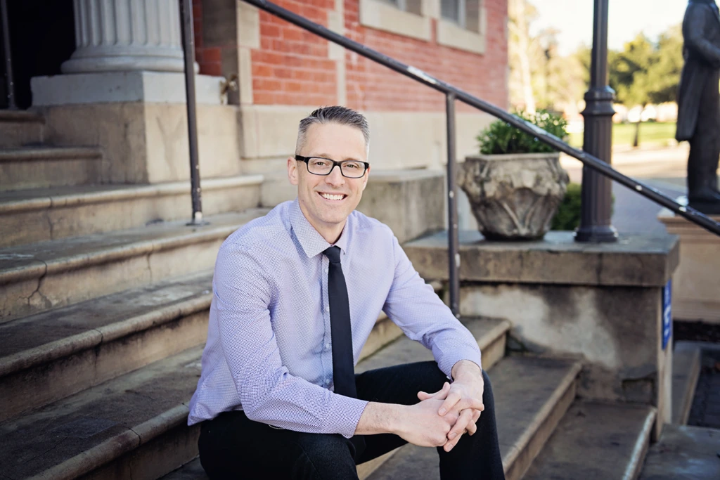Dr. Joe Holbrook seated outdoors